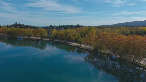 Lakeside Serenity: Autumn Trees Reflection on Tranquil Waters Stock Footage 263352661