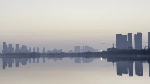 Lakeside Towers Reflected At Dawn 01 in China 4K Stock Footage 346219371