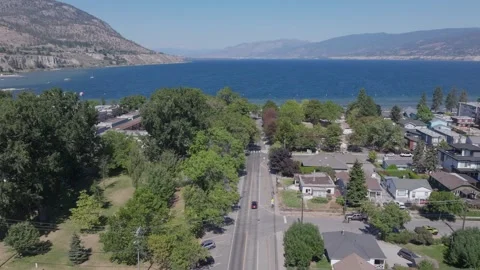 Lakeside town in a valley Видео 345045567