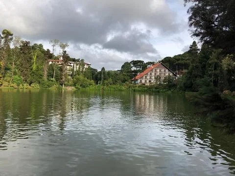 Lakeside Tranquility with Cottages Stock Photos