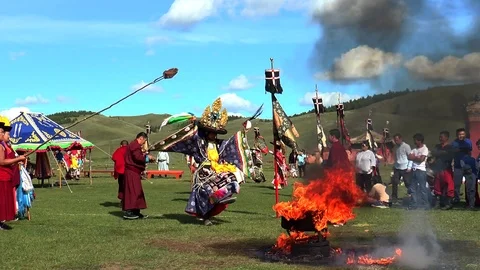 Lamas of a Buddhist monastery in Mongolia perform a sacred religious dance. Stock Footage 121889143