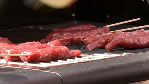 Lamb and Cucumber on the grill Stock Footage 85315236