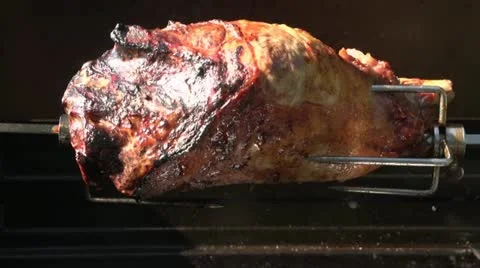 Lamb on barbecue spit Stock Footage 20802926