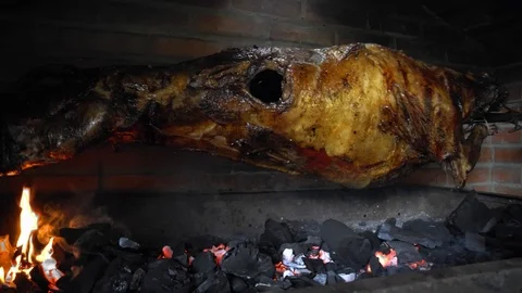 Lamb carcass roasted on a spit Video stock 120801312