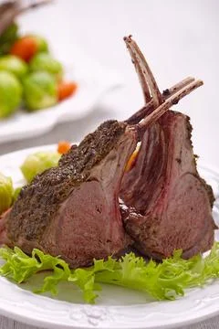 Lamb chops with brussel sprouts and carrots Stock Photos