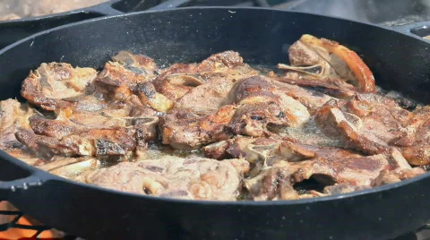 Lamb chops cooking with smoke P HD 6616 Stock Footage 647537