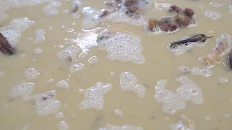 Lamb curry, cooking over fire, hot until boiling in large pan, authentic detail Stock Footage 293179079