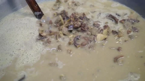 Lamb curry, cooking over fire, hot until boiling in large pan, authentic detail Stock Footage 293179084
