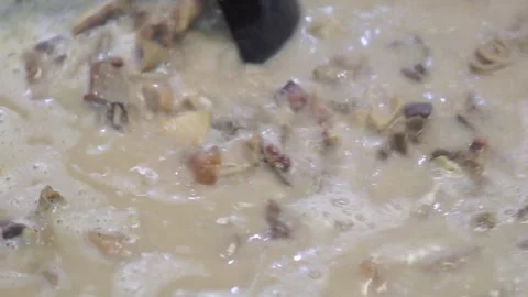 Lamb curry, cooking over fire, hot until boiling in large pan, authentic detail Stock Footage 293179086