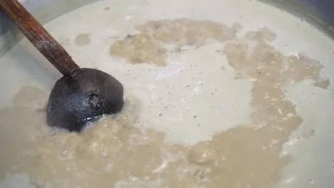 Lamb curry, cooking over fire, hot until boiling in large pan, authentic detail Stock Footage 293179307