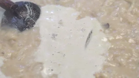 Lamb curry, cooking over fire, hot until boiling in large pan, authentic detail Stock Footage 293179370
