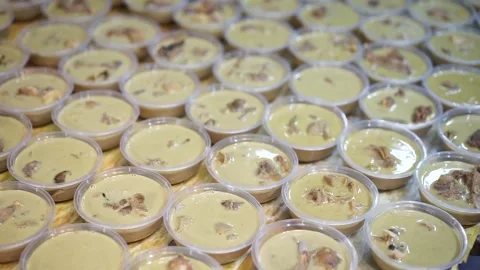 Lamb curry, serving in plastic cups for customers on the table, authentic detail Stock Footage 293180135