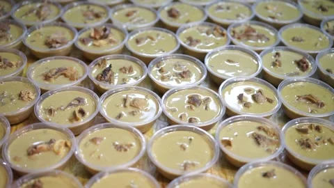Lamb curry, serving in plastic cups for customers on the table, authentic detail Stock Footage 293180202