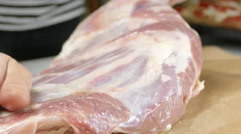 Lamb leg preparing for baking, 4k Stock Footage 60777307