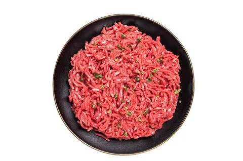 Lamb Mutton ground mince raw meat, forcemeat on a black plate, isolated on .. Stock Photos