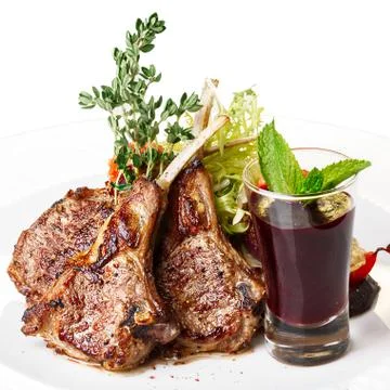 Lamb rack with garnish Stock Photos