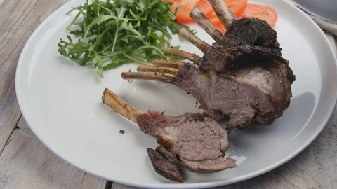 Lamb ribs with vegetables Video stock 83491824