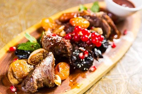 Lamb roast with plums Stock-Fotos