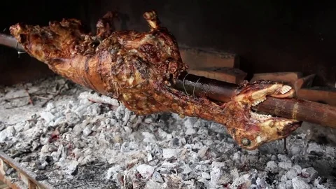 Lamb roasting on a spit Stock-Footage 75272756