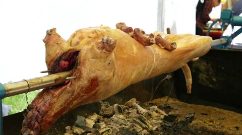 Lamb on the spit - Cooking grilled lamb carcasses on the street food festival Stock Footage 67172297