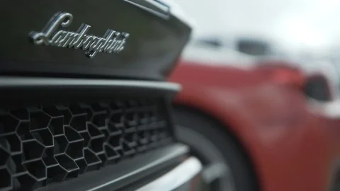Lamborghini Logo With Red Ferrari in Background Video stock 120149648