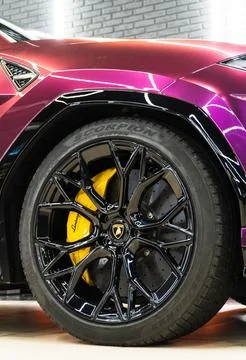 Lamborghini Urus in violet PPF is a high performance luxury SUV car. Stock Photos