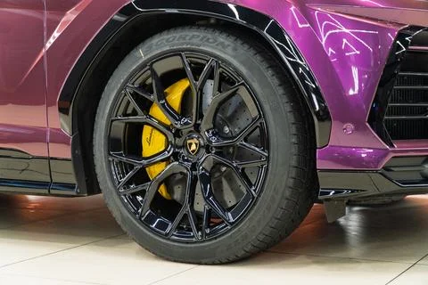 Lamborghini Urus in violet PPF is a high performance luxury SUV car. Stock Photos