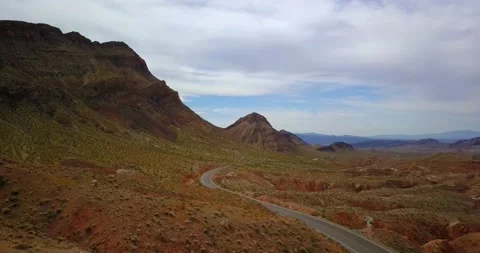 Lamborghinis driving through desert mountains Stock Footage 137838596