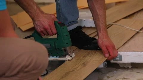 Laminate is being cut in half with a jigsaw Stock Footage 113792202