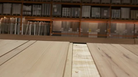 Laminate flooring samples on display in large home improvement store showroom Stock Footage 321183967