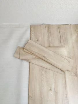 Laminated flooring under construction process. Home renewal concept Stock Photos