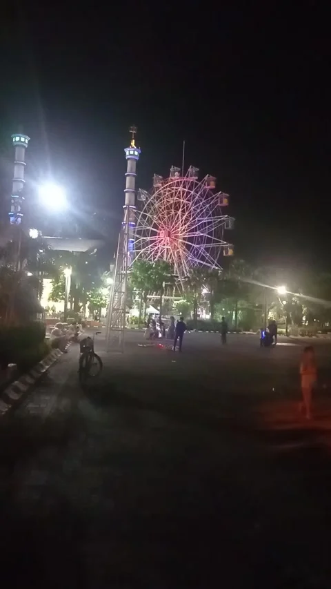 Lamongan East Java Indonesia. City park and Ferris wheel On May 6 2025 Stock Footage 313255981