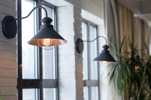 A lamp on the background of a window and a wall with curtains Foto stock