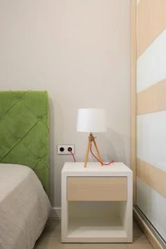 Lamp on the bedside table in the bedroom 库存照片