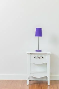 Lamp on bedside table Stock Photos