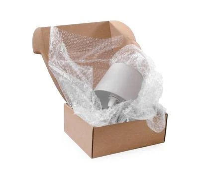 Lamp with bubble wrap in cardboard box isolated on white Stockfoto's