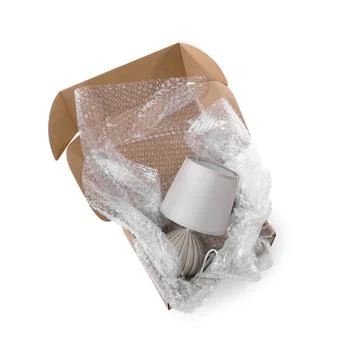 Lamp with bubble wrap in cardboard box isolated on white, above view Stock Photos