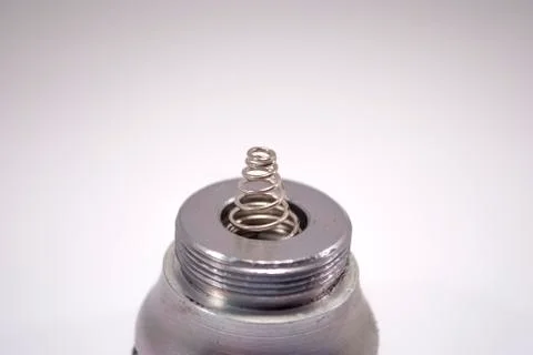 Lamp cap spring closeup on white Stock Photos