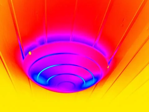 The lamp on the ceiling on a colored background Stock Photos