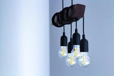 The lamp on the ceiling of the light bulbs located on the wires. Stock Photos