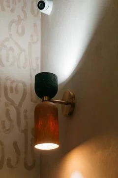 A lamp in the corner of the cafe room. table lighting device for visitors Stock Photos