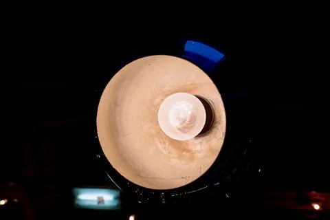 Lamp on a dark background under the ceiling in a cafe Фото