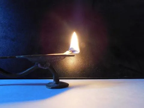 Lamp flame with a dark background Stock Photos