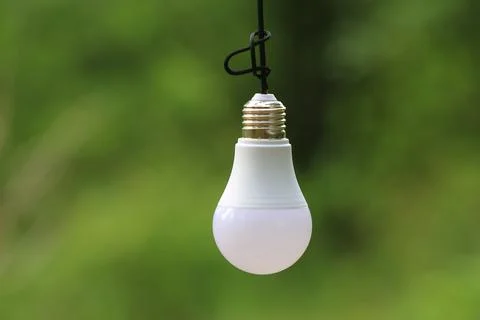 Lamp on green background Stock Photos