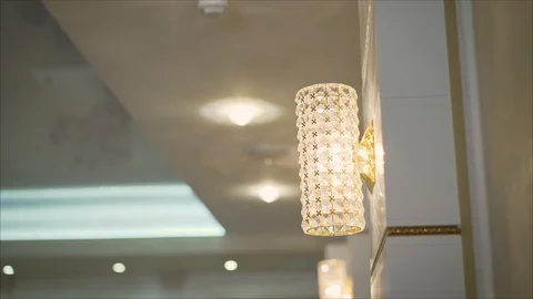 The lamp hangs on the wall in the apartment Video stock 103197283