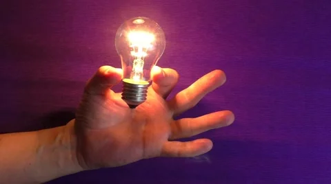 Lamp in human hand Video stock 58012686