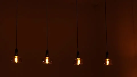 A Lamp Inside a Cafe. The Bulb Is On And Generating Light. Stock Footage 304575564