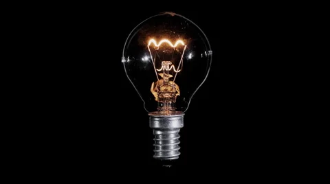 Lamp light bulb twinkles over black, macro view, loop Video stock 64073507