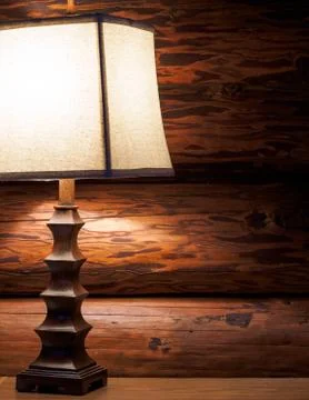 Lamp in log home Stock Photos