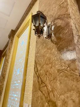 A lamp is mounted on a wall Foto stock